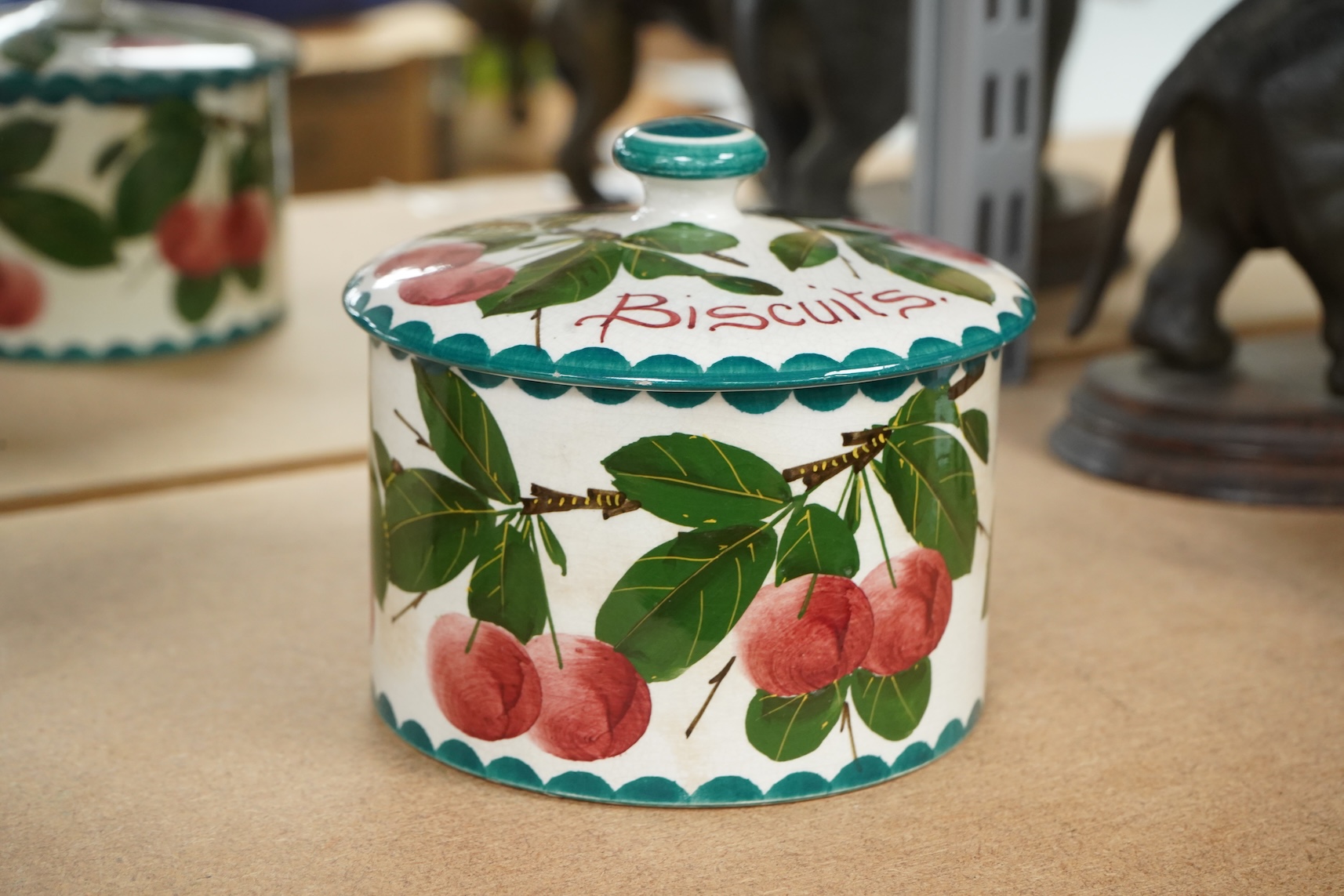 A Wemyss lidded biscuits box, 13cm diameter